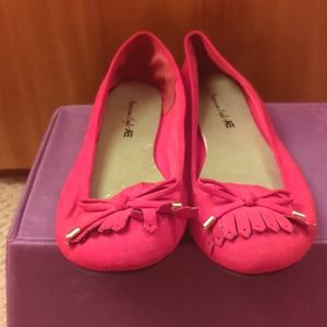 American Eagle red moccasins with tassels